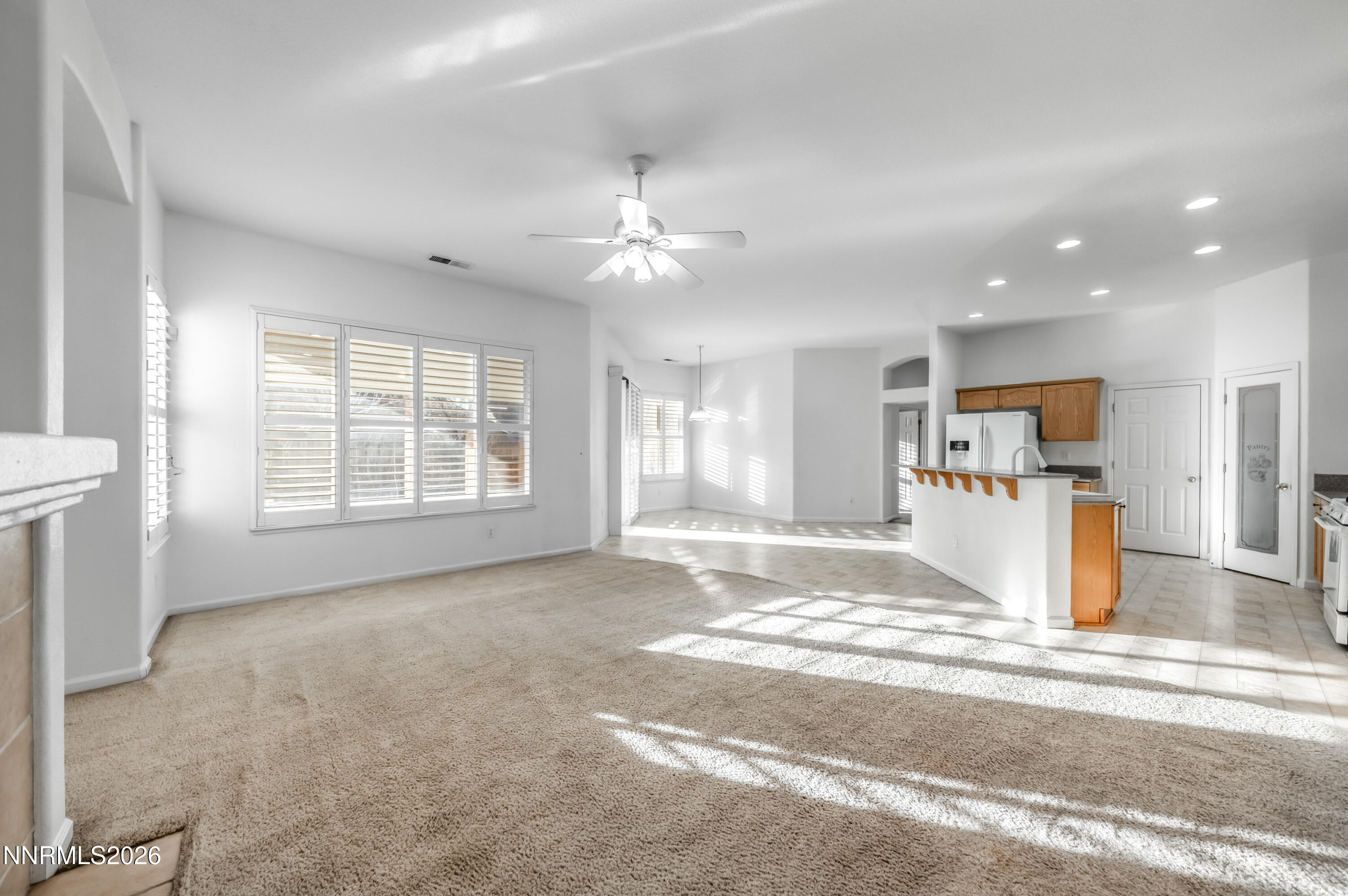 10145 Lucente Way Reno, NV 89521 - Photo 15 of 54 a view of a kitchen with refrigerator and a sink