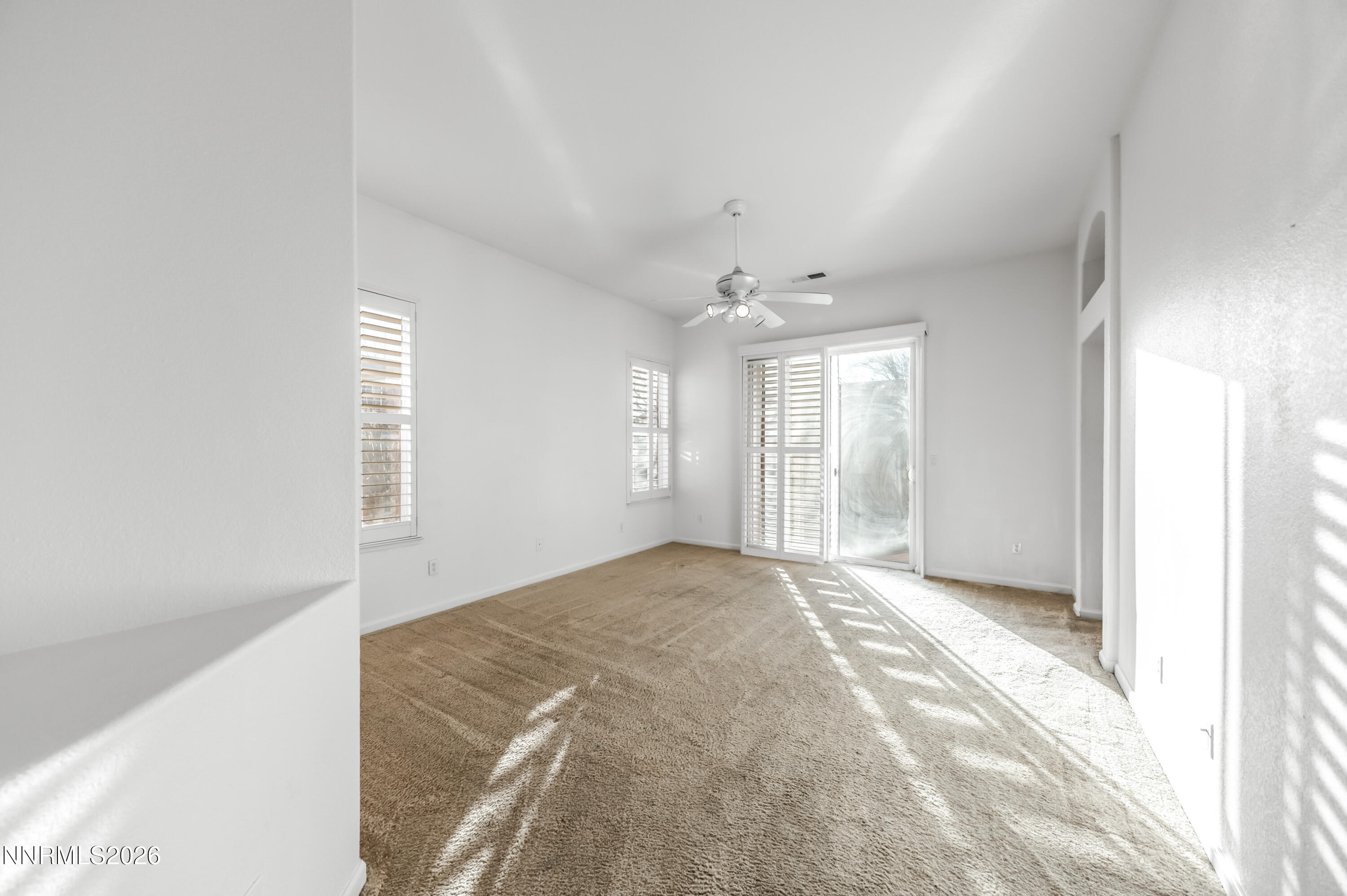 10145 Lucente Way Reno, NV 89521 - Photo 26 of 54 a view of an empty room with a window