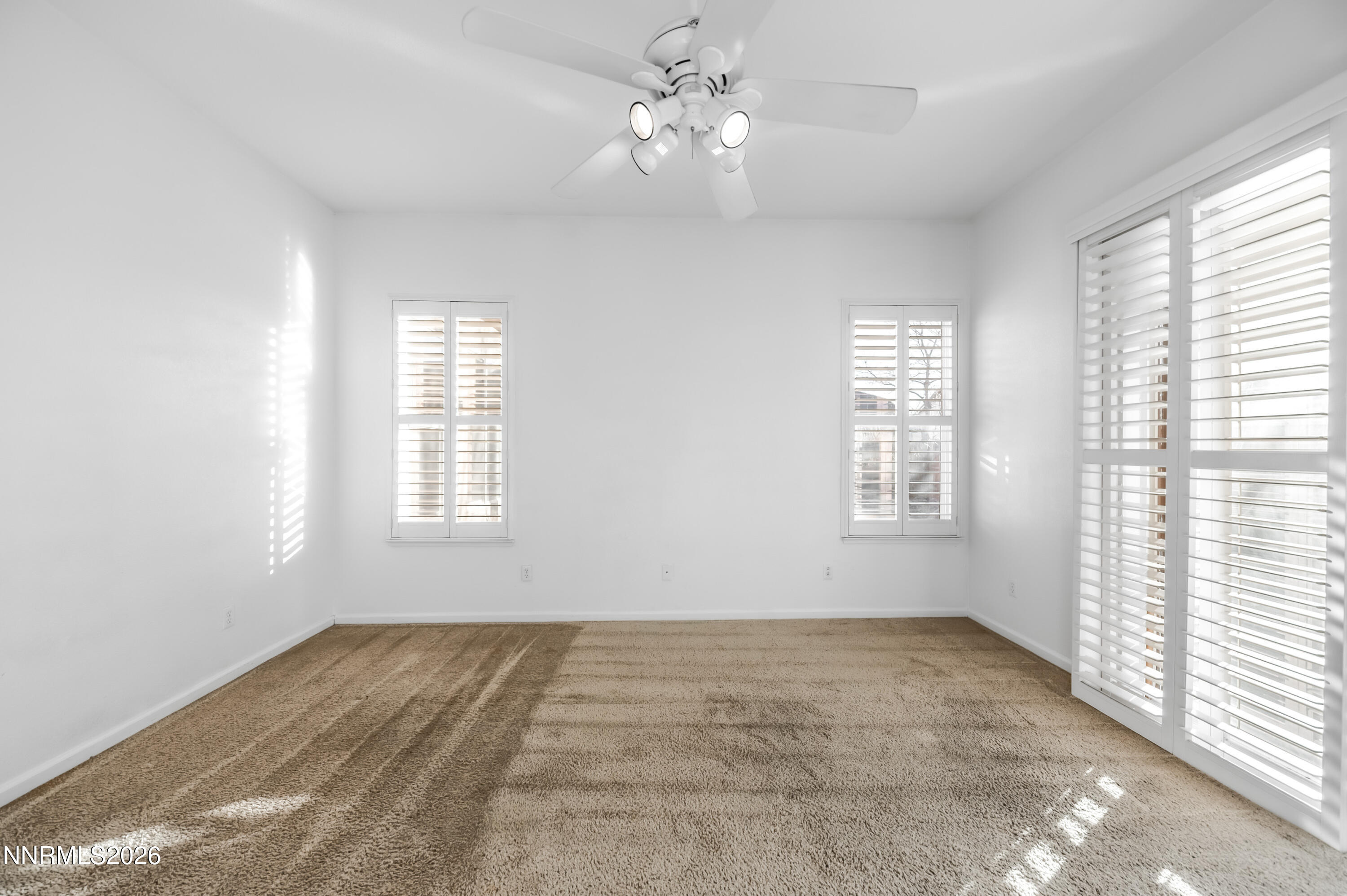 10145 Lucente Way Reno, NV 89521 - Photo 27 of 54 a view of an empty room with a window