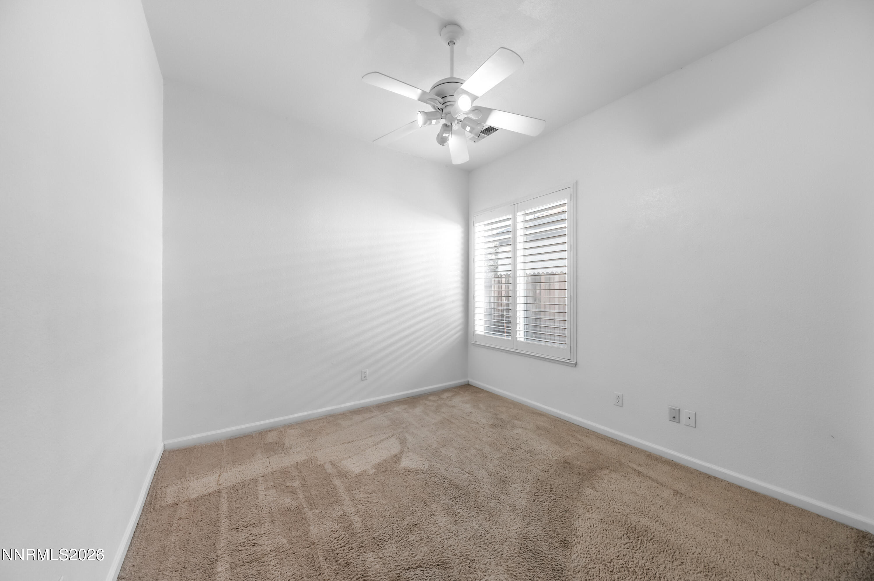 10145 Lucente Way Reno, NV 89521 - Photo 32 of 54 a view of an empty room with a window