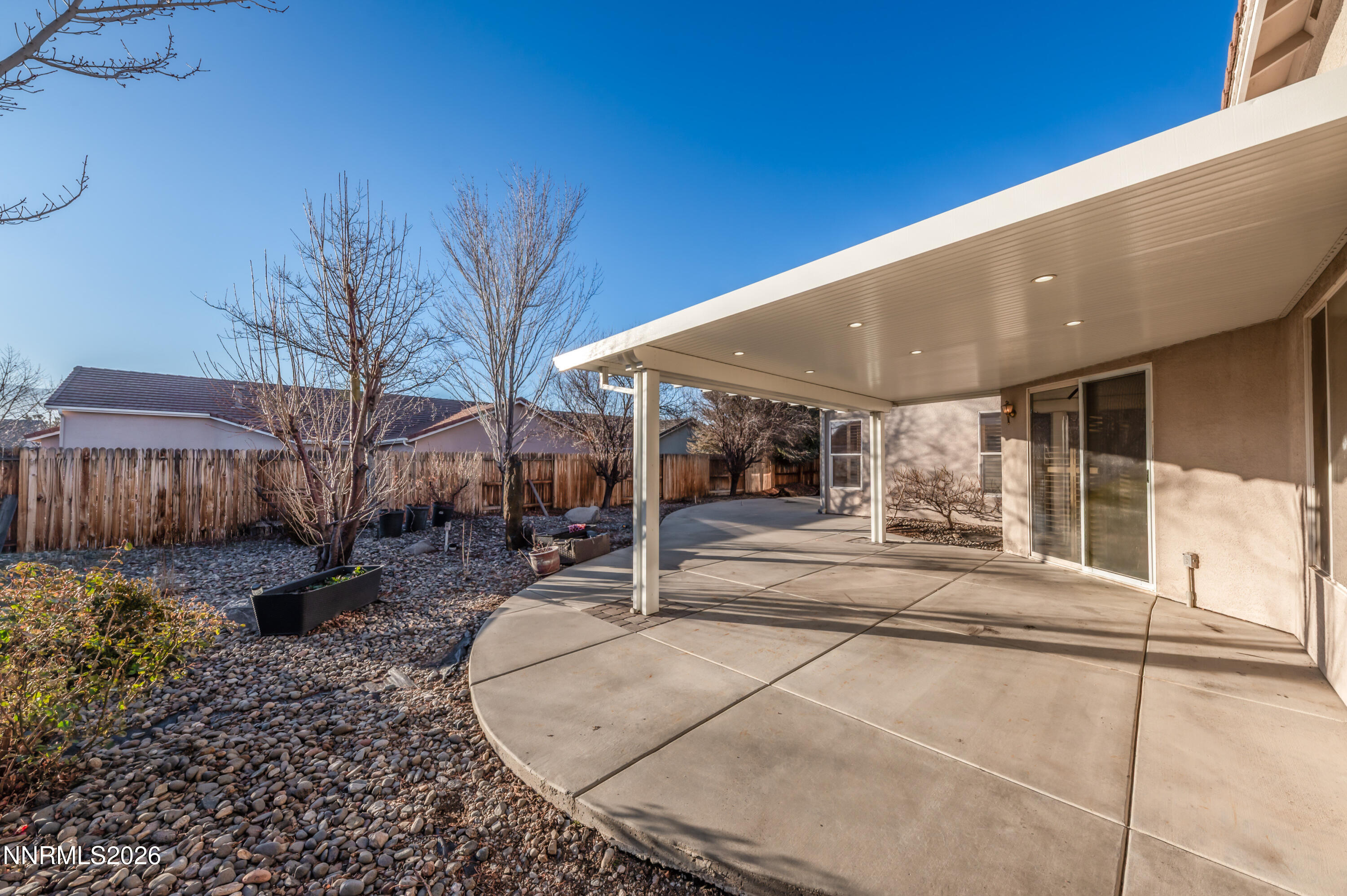 10145 Lucente Way Reno, NV 89521 - Photo 38 of 54 a view of a house with backyard and sitting area