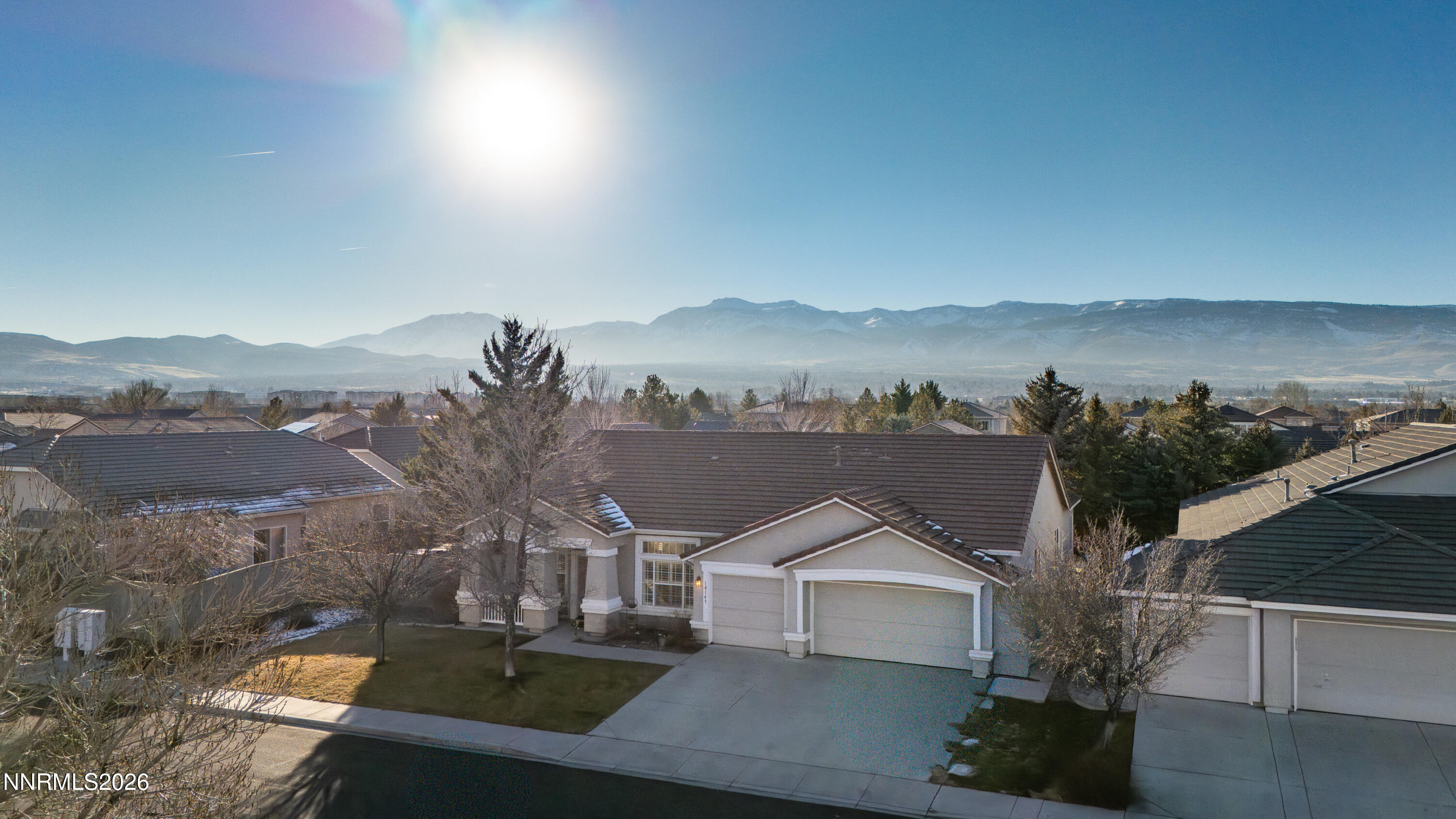 10145 Lucente Way Reno, NV 89521 - Photo 45 of 54 a view of house with yard and mountain view