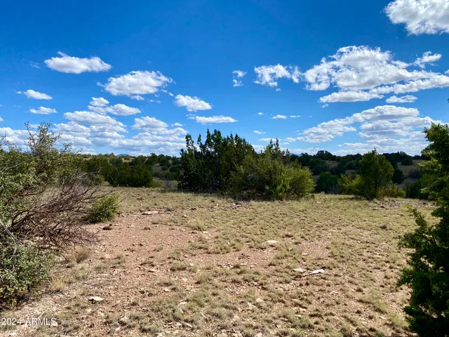 a view of a road with a building in the background