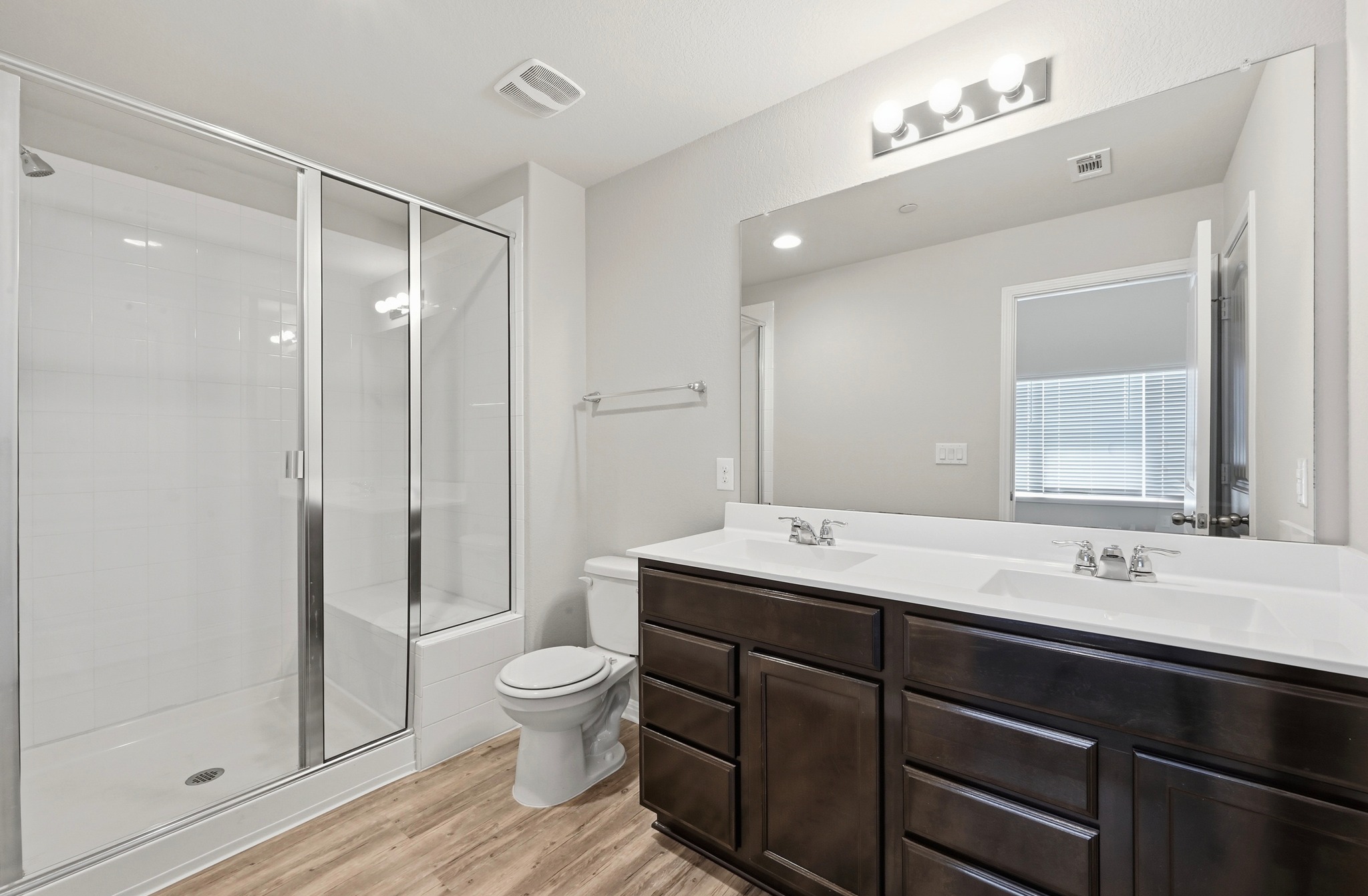 516 East Slaughter Lane, Unit 603 Austin, TX 78744 - Photo 20 of 26 a bathroom with a sink shower and a toilet