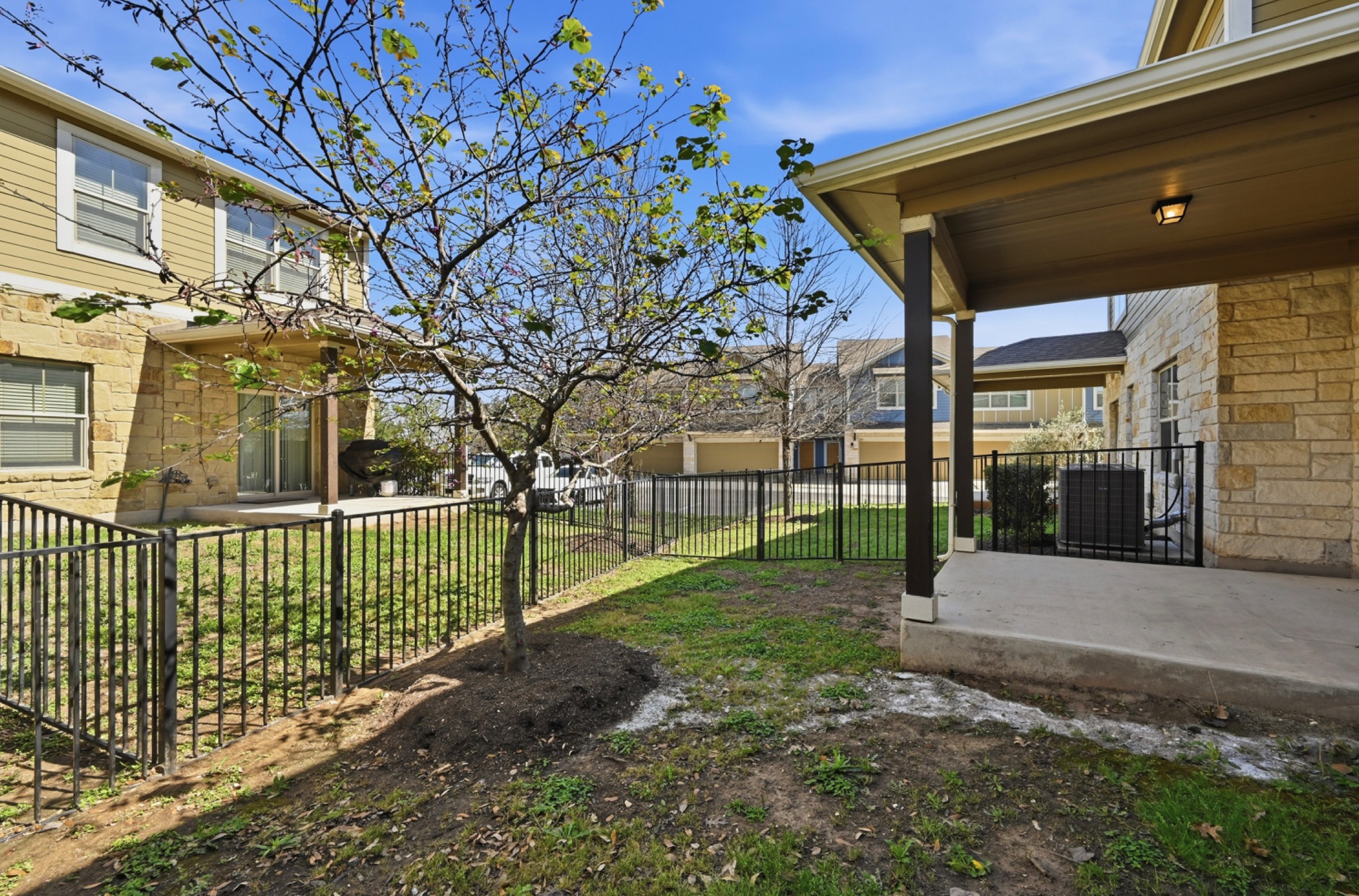 516 East Slaughter Lane, Unit 603 Austin, TX 78744 - Photo 24 of 26 a view of a house with a yard