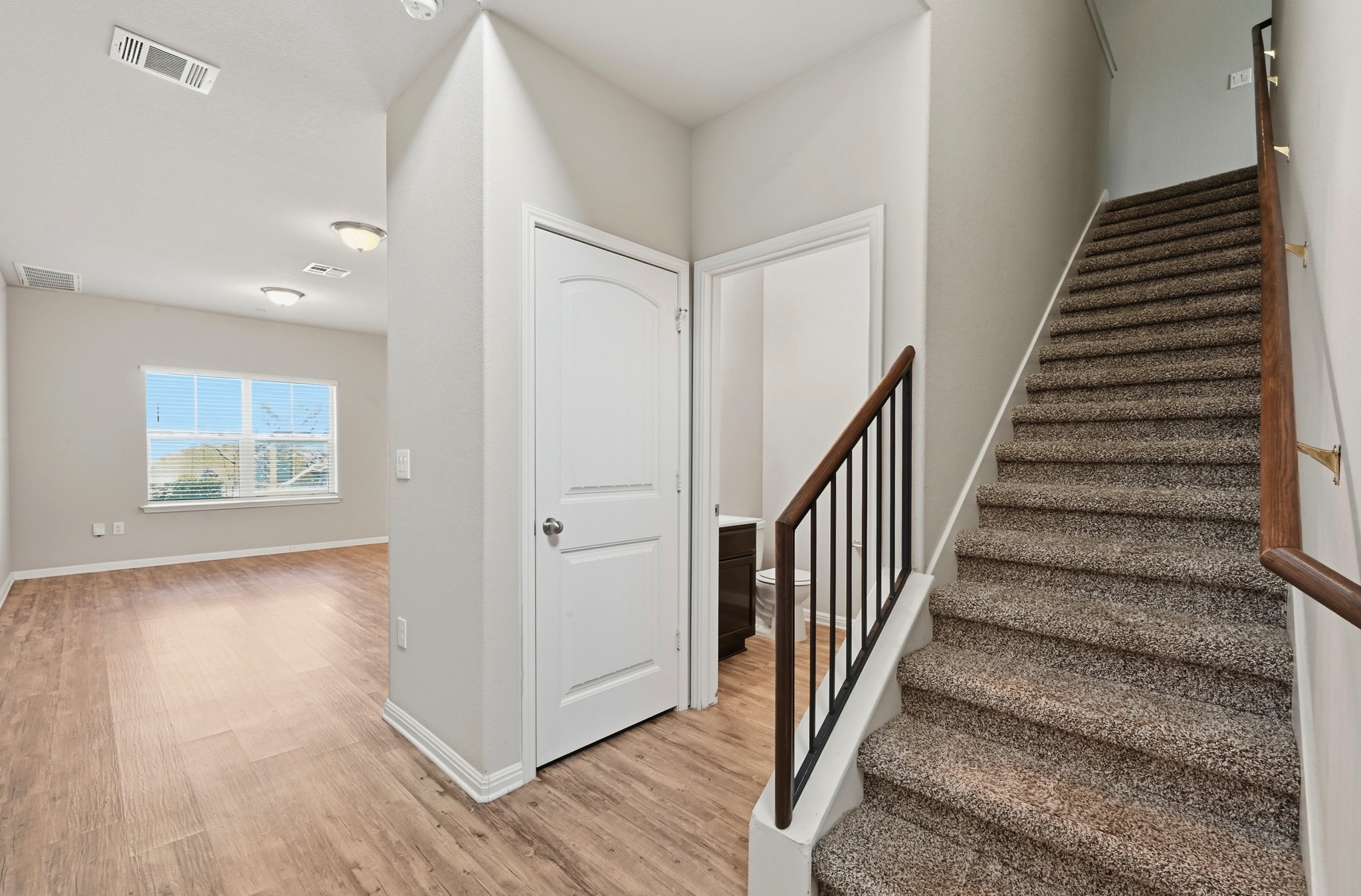 516 East Slaughter Lane, Unit 603 Austin, TX 78744 - Photo 3 of 26 a view of a hallway with wooden floor and entryway