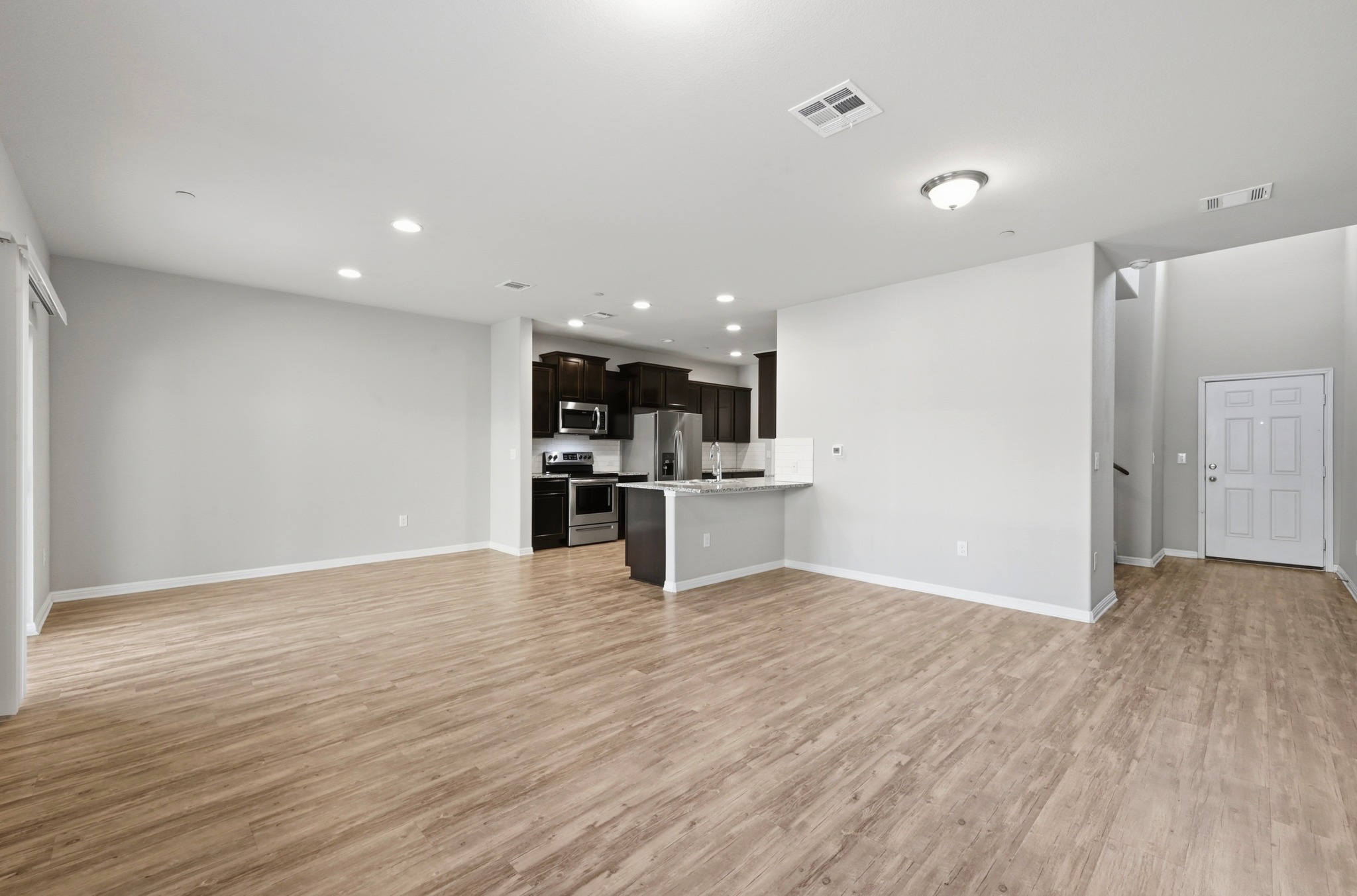516 East Slaughter Lane, Unit 603 Austin, TX 78744 - Photo 7 of 26 a view of kitchen with wooden floor