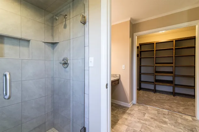 a view of a house with a swimming pool and a yard