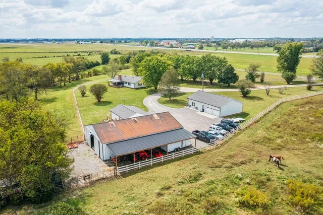 a view of a car park in front view of a house