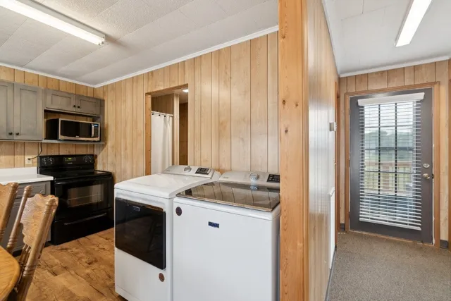 a bathroom with a granite countertop sink a mirror and a toilet
