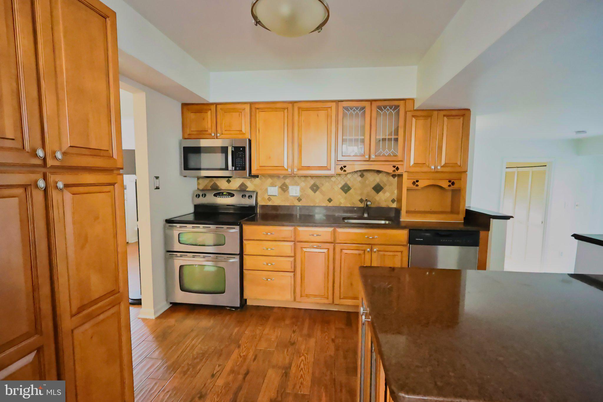 4402 Fieldgreen Road Nottingham, MD 21236 - Photo 16 of 52 Warm wood tones in a modern kitchen.