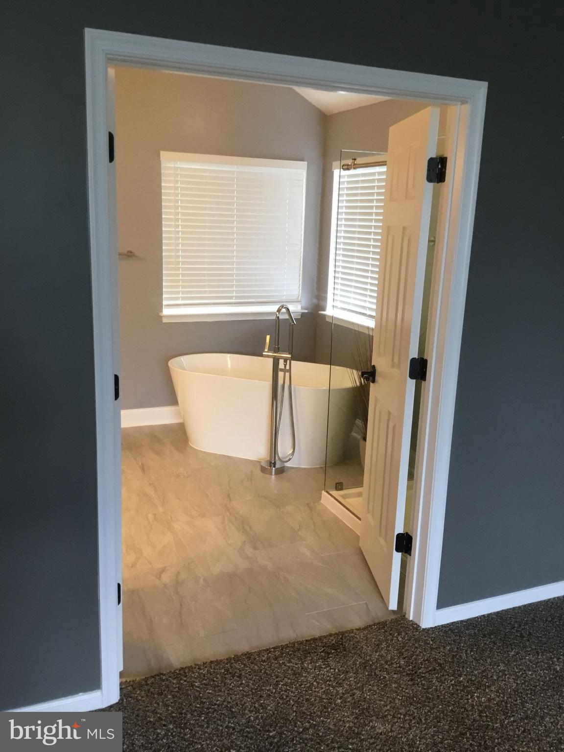 302 Riding Trail Court Northwest Leesburg, VA 20176 - Photo 11 of 15 a view of an empty room with a window