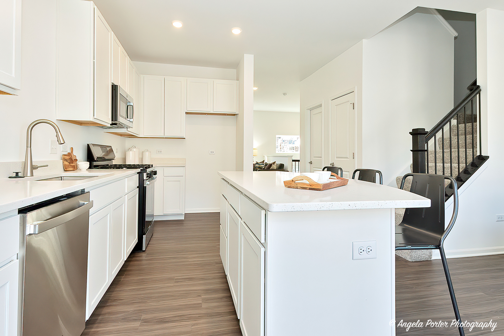 402 Neubauer Circle Lindenhurst, IL 60046 - Photo 12 of 29 a kitchen with a sink a counter top space stainless steel appliances and cabinets