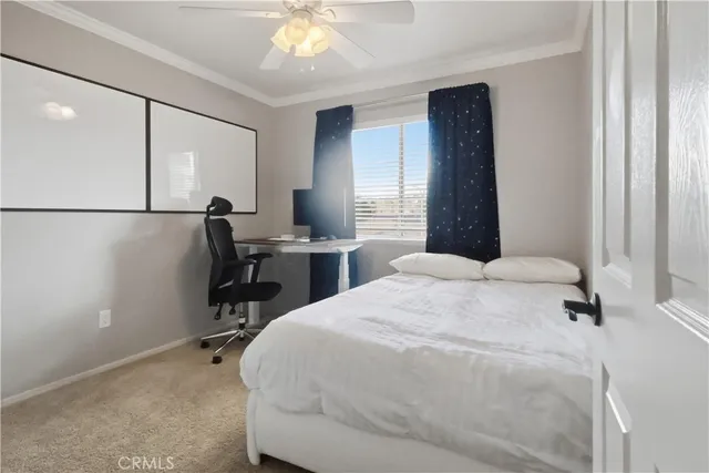 a bedroom with a bed and a table in it