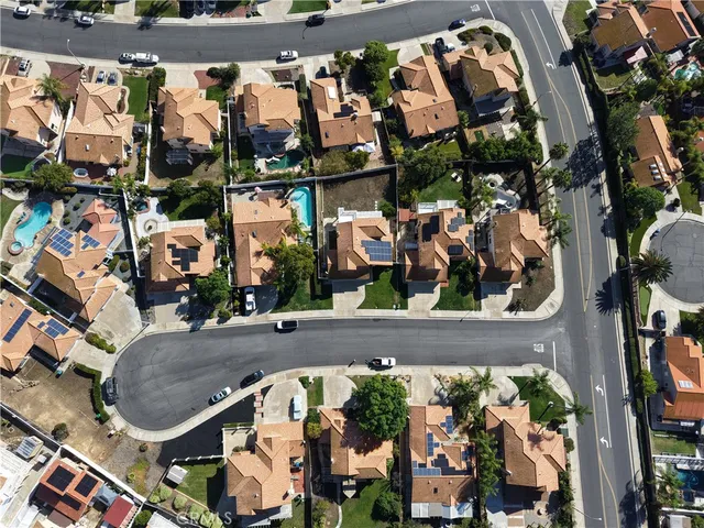 an outdoor space view with couple of cars parked in front of it