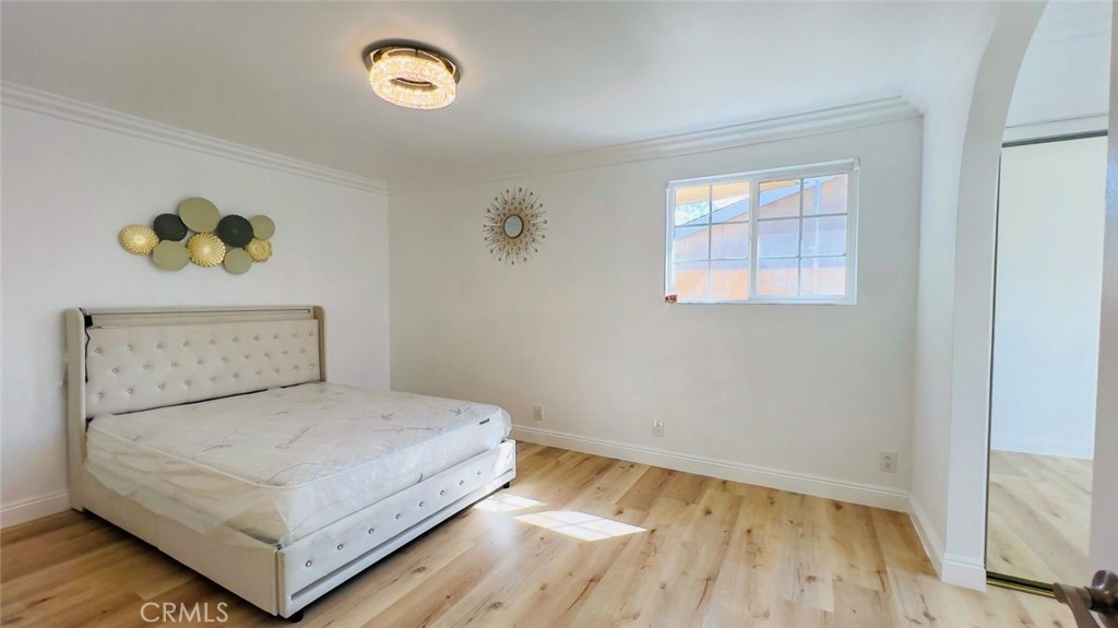 900 South Hayward Street Anaheim, CA 92804 - Photo 16 of 38 a bedroom with a bed and a window