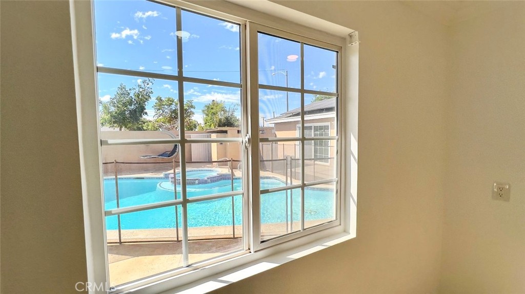 900 South Hayward Street Anaheim, CA 92804 - Photo 19 of 38 a view of a glass door with a tree in it