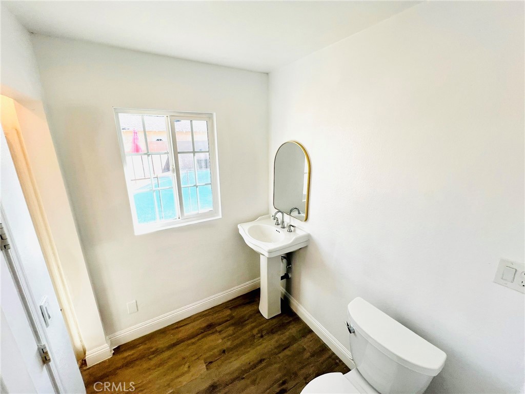 900 South Hayward Street Anaheim, CA 92804 - Photo 26 of 38 a bathroom with a sink toilet and a window