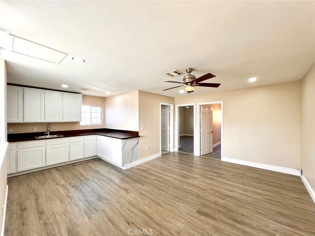 900 South Hayward Street Anaheim, CA 92804 - Photo 30 of 38 a large kitchen with stainless steel appliances granite countertop a large counter top and sink