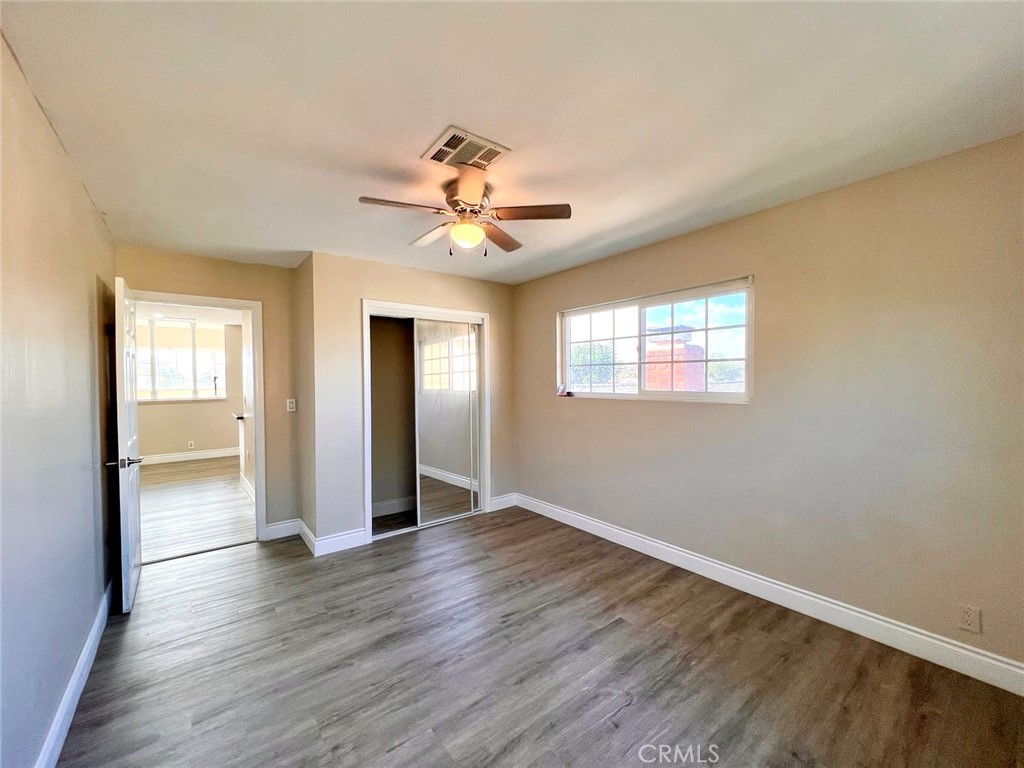 900 South Hayward Street Anaheim, CA 92804 - Photo 33 of 38 a view of an empty room with window and wooden floor