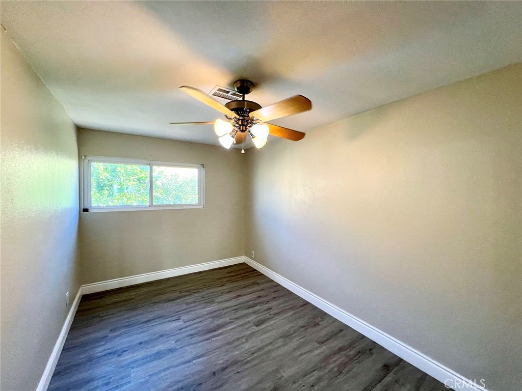 900 South Hayward Street Anaheim, CA 92804 - Photo 36 of 38 wooden floor in an empty room with a window
