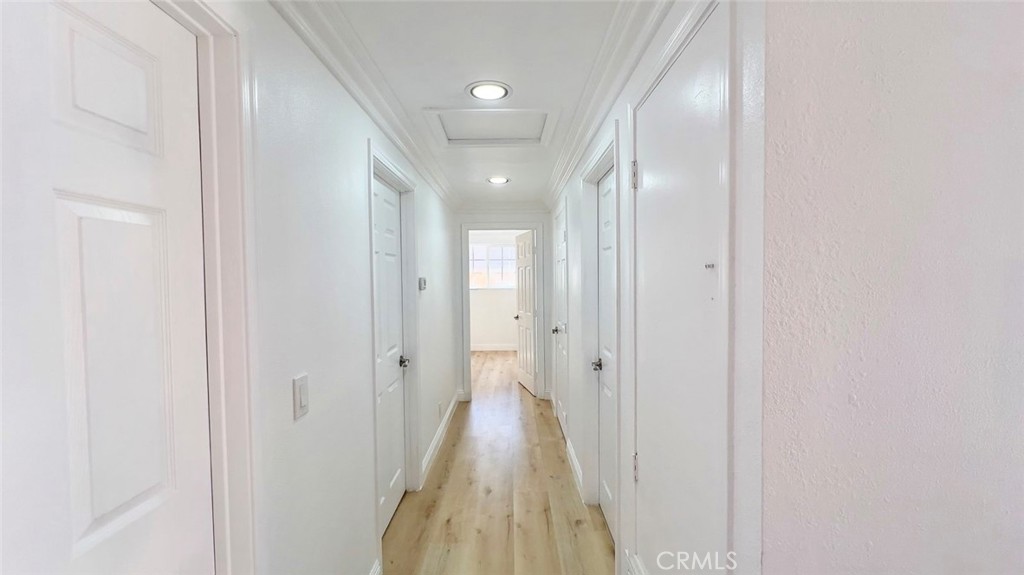 900 South Hayward Street Anaheim, CA 92804 - Photo 8 of 38 a view of a hallway with wooden floor