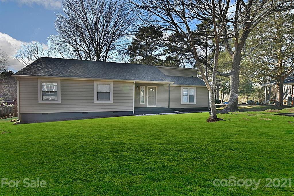 4078 Point Clear Drive Tega Cay, SC 29708 - Photo 1 of 28 a view of a yard in front of a house with large trees