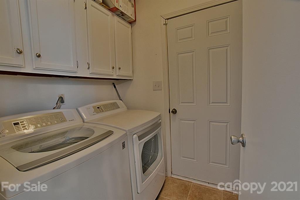4078 Point Clear Drive Tega Cay, SC 29708 - Photo 22 of 28 a utility room with dryer and washer
