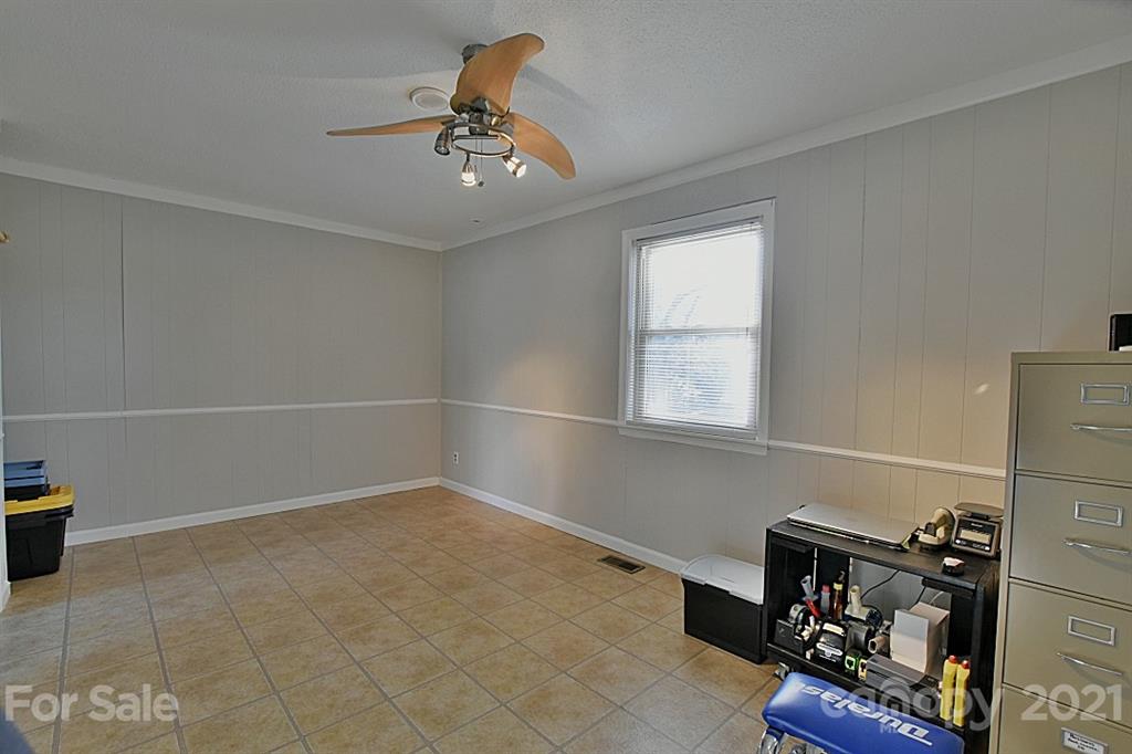 4078 Point Clear Drive Tega Cay, SC 29708 - Photo 23 of 28 a view of a room with gym equipment and a window
