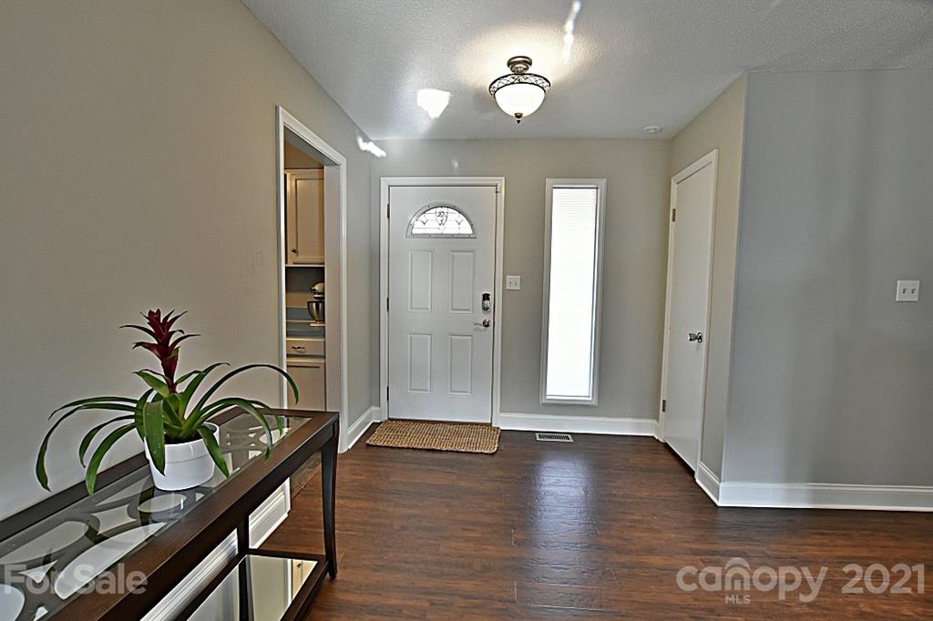 4078 Point Clear Drive Tega Cay, SC 29708 - Photo 4 of 28 a view of a hallway with wooden floor