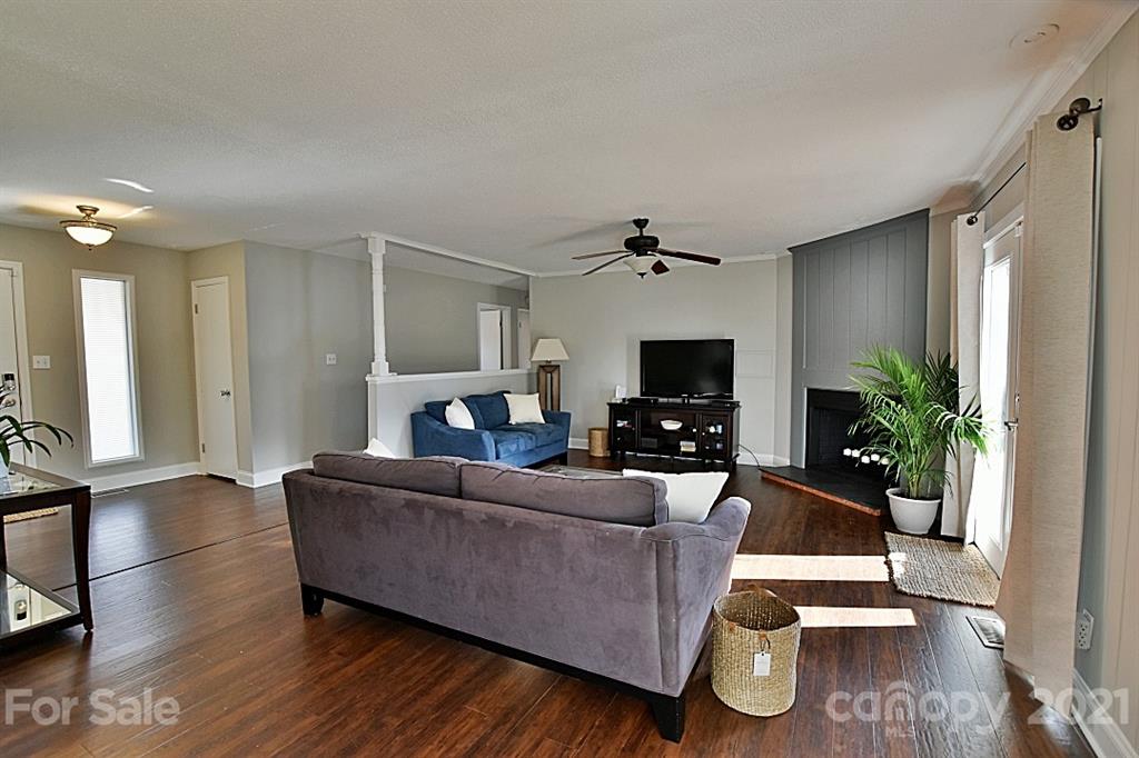 4078 Point Clear Drive Tega Cay, SC 29708 - Photo 6 of 28 a living room with furniture and a flat screen tv