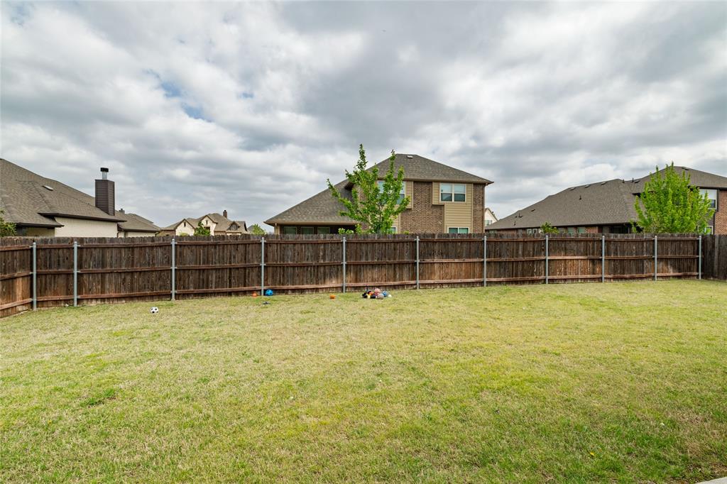 4045 Grove Valley Road Midlothian, TX 76065 - Photo 30 of 34 Fenced backyard with a residential view