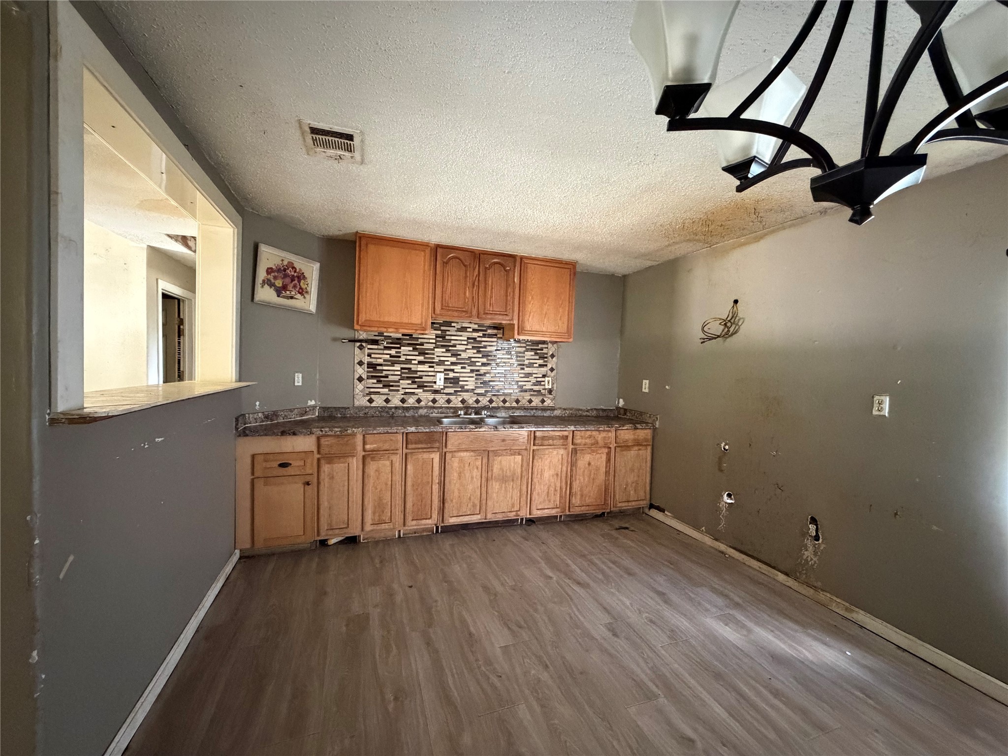 735 Pecan Street Fresno, TX 77545 - Photo 2 of 7 a kitchen with stainless steel appliances granite countertop a stove a sink and a refrigerator