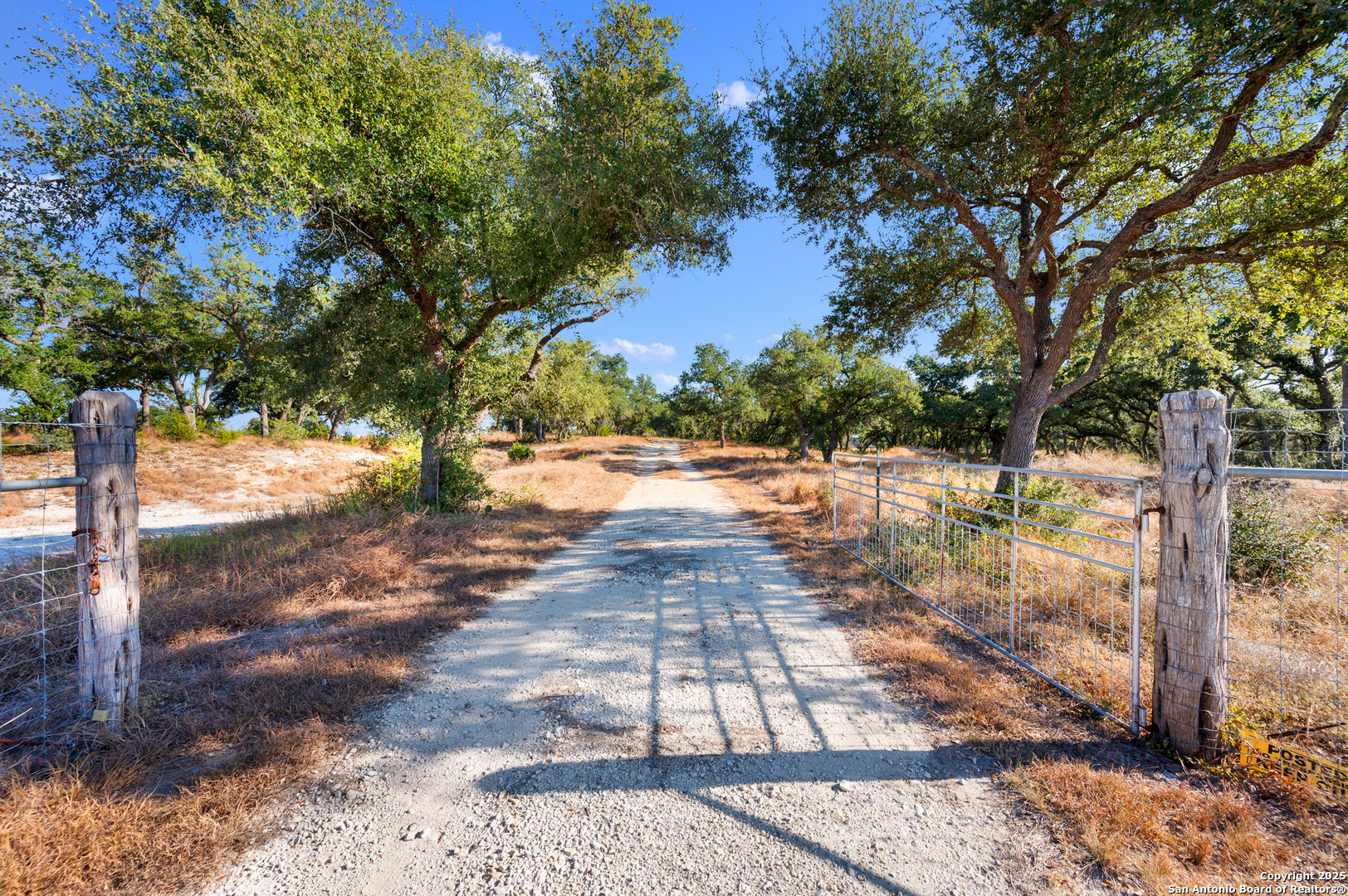 a view of yard with wooden fence