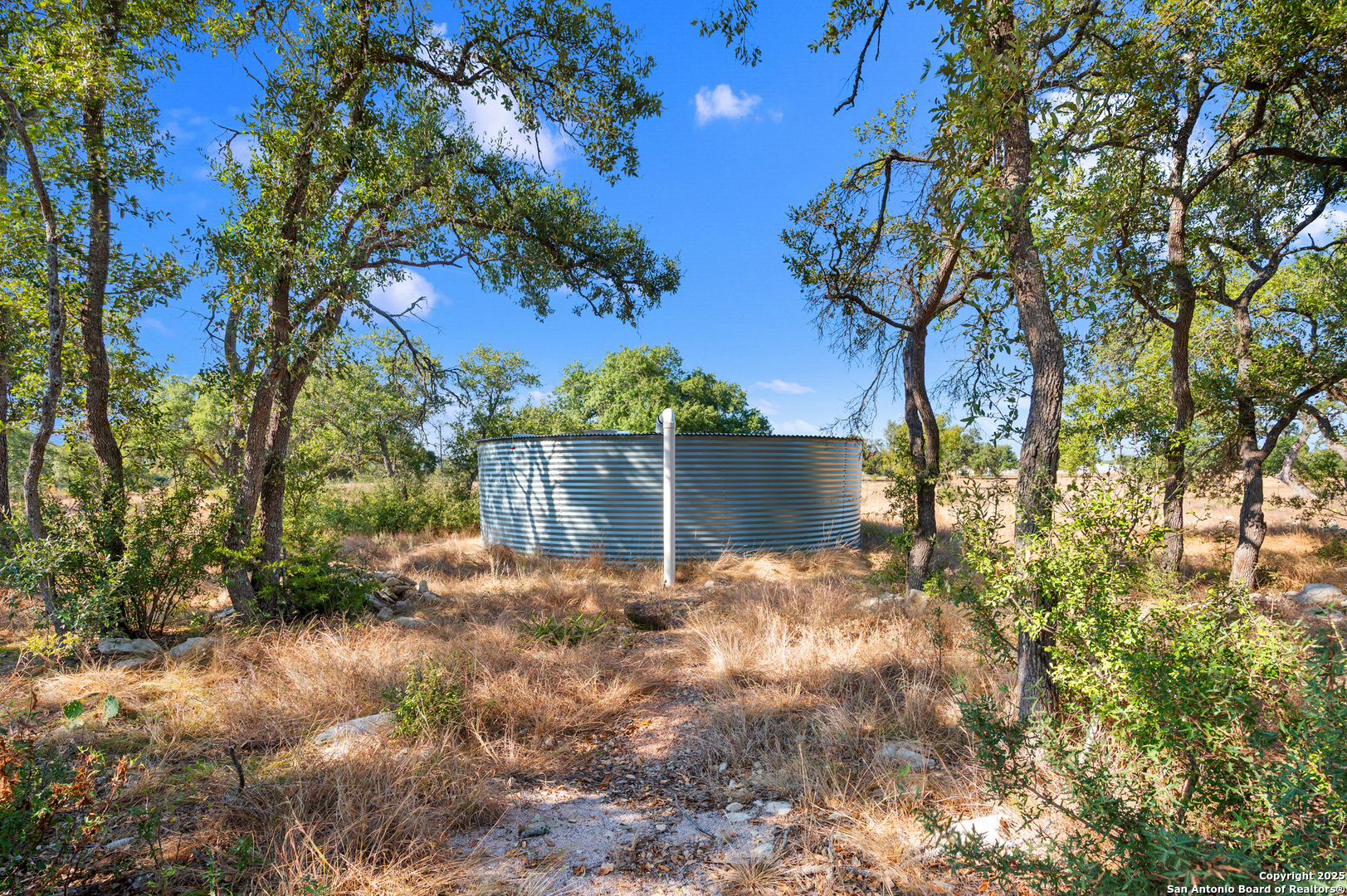 235 Sattler Road Spring Branch, TX 78070 - Photo 11 of 43 a backyard of a house with lots of green space