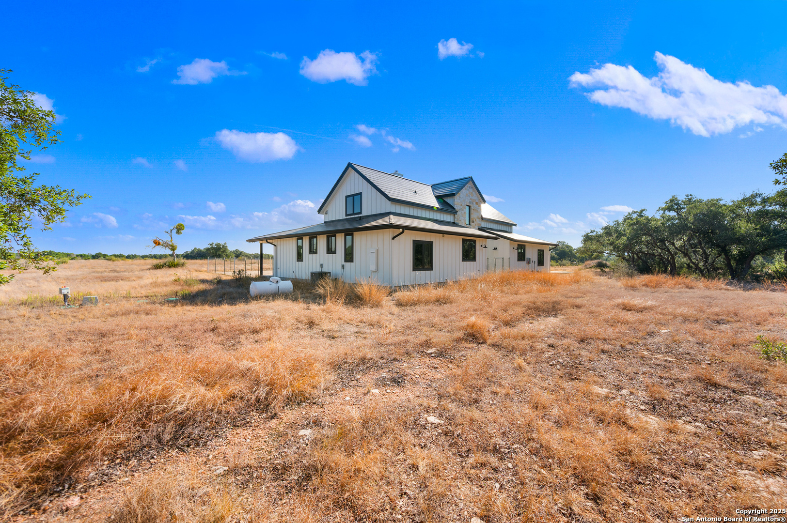 235 Sattler Road Spring Branch, TX 78070 - Photo 23 of 43 a front view of a house with a yard