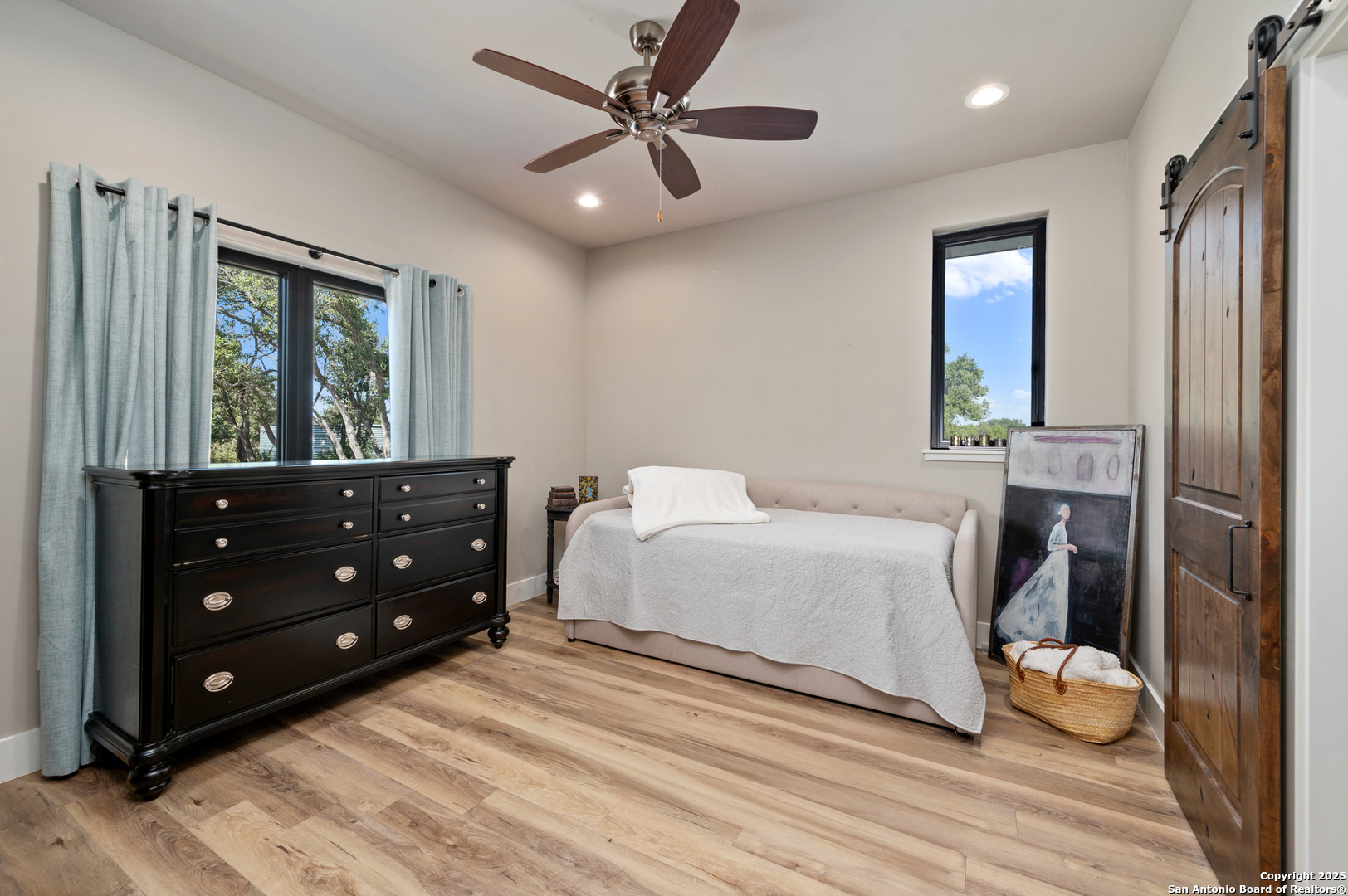 235 Sattler Road Spring Branch, TX 78070 - Photo 32 of 43 a bedroom with a bed and a mirror