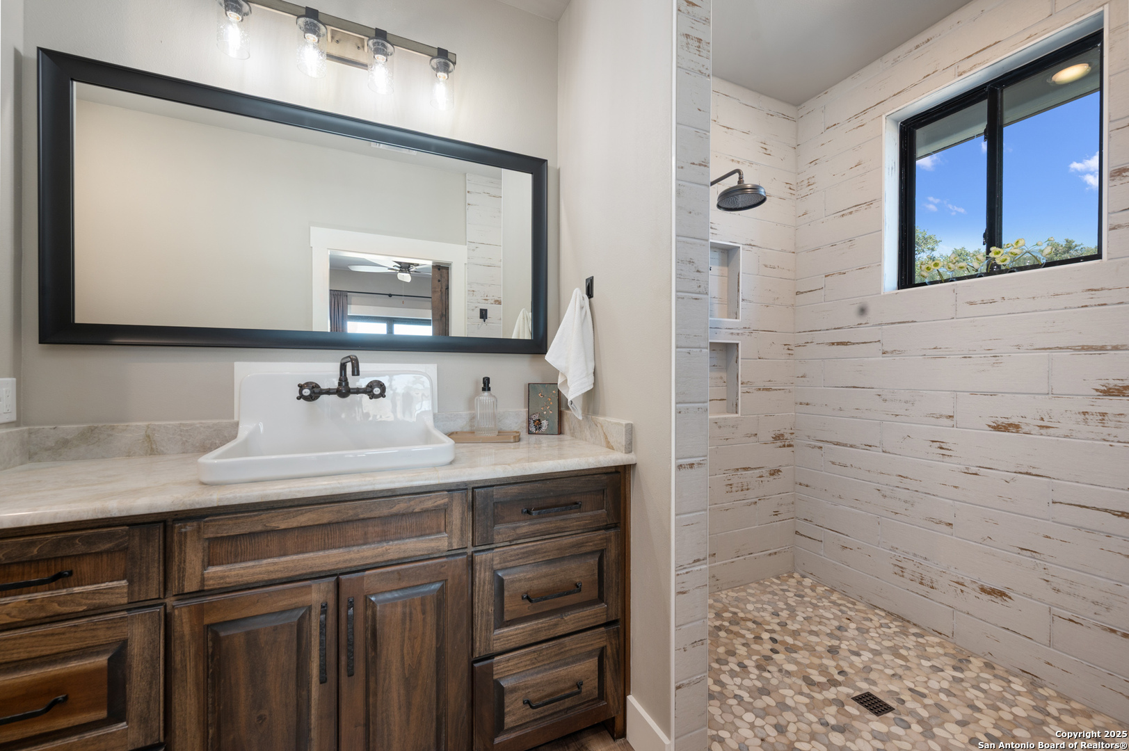 235 Sattler Road Spring Branch, TX 78070 - Photo 35 of 43 a bathroom with a sink and a mirror