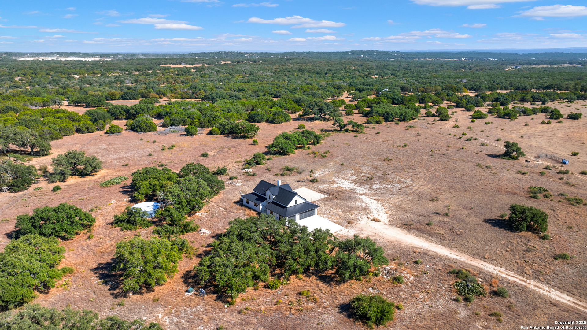 235 Sattler Road Spring Branch, TX 78070 - Photo 38 of 43 a view of a town with mountains in the background