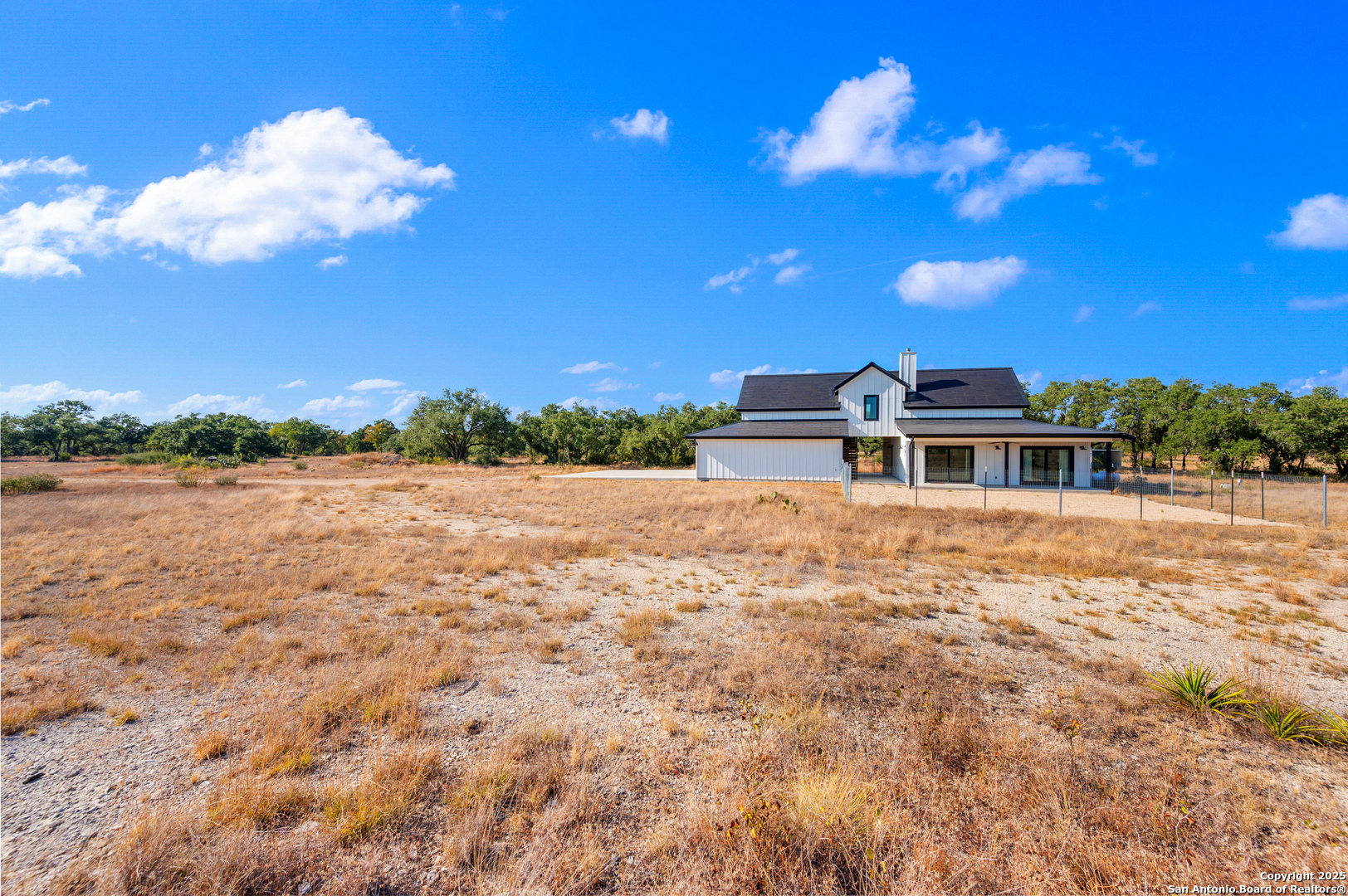 235 Sattler Road Spring Branch, TX 78070 - Photo 4 of 43 a view of a house with a yard