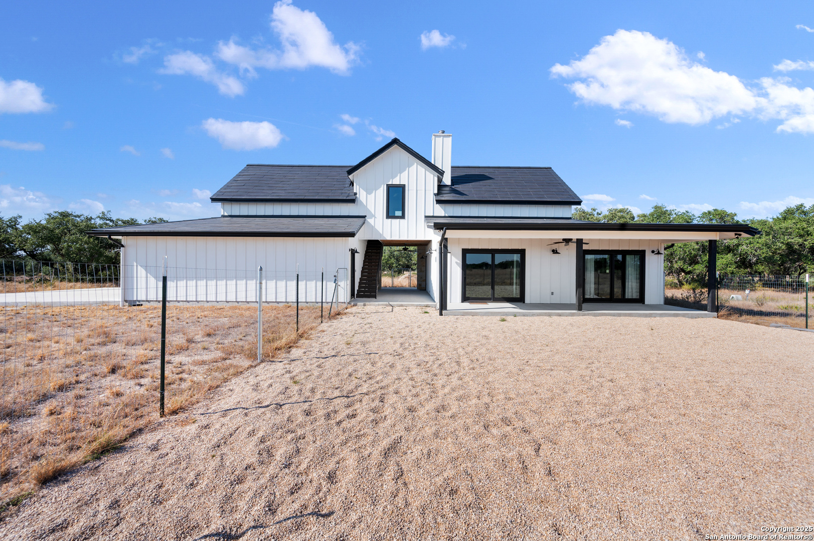 235 Sattler Road Spring Branch, TX 78070 - Photo 8 of 43 a front view of a house with a yard