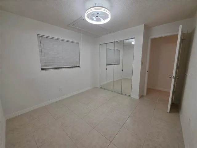 an empty room with a mirror