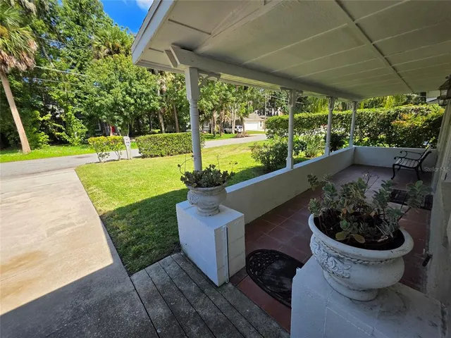 a view of a backyard with garden and plants