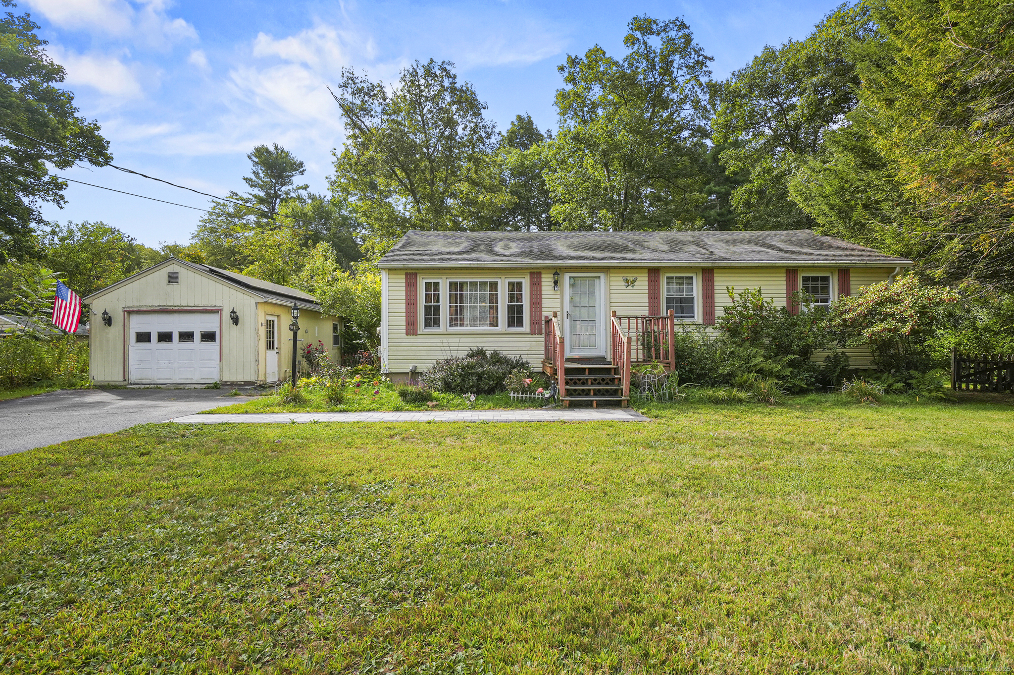 31 Rawson Avenue Thompson, CT 06255 - Photo 1 of 1 a front view of house with yard and green space