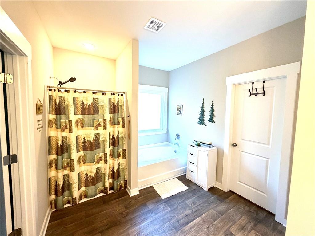 386 Westminster Trail Winder, GA 30680 - Photo 16 of 20 a bathroom with a shower