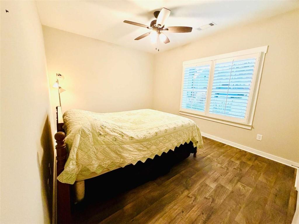386 Westminster Trail Winder, GA 30680 - Photo 17 of 20 a bed sitting in a bedroom next to a window
