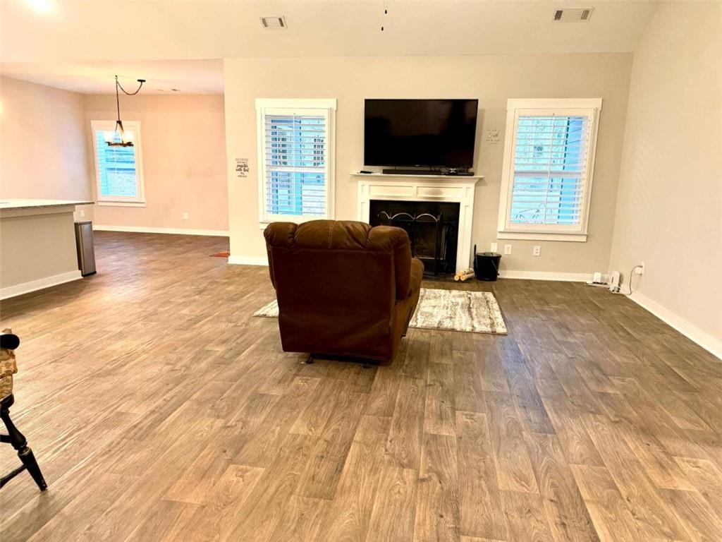 386 Westminster Trail Winder, GA 30680 - Photo 7 of 20 a living room with furniture and a flat screen tv