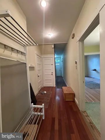 a view of kitchen with granite countertop cabinets and appliances