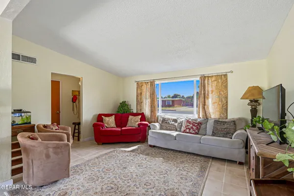 a living room with furniture and a window