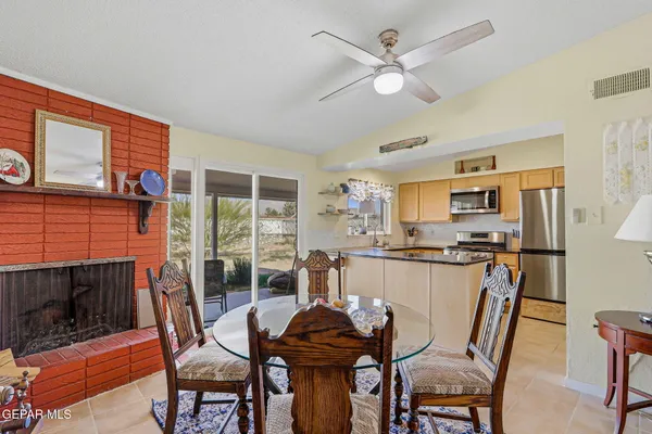 a dining room with furniture and window